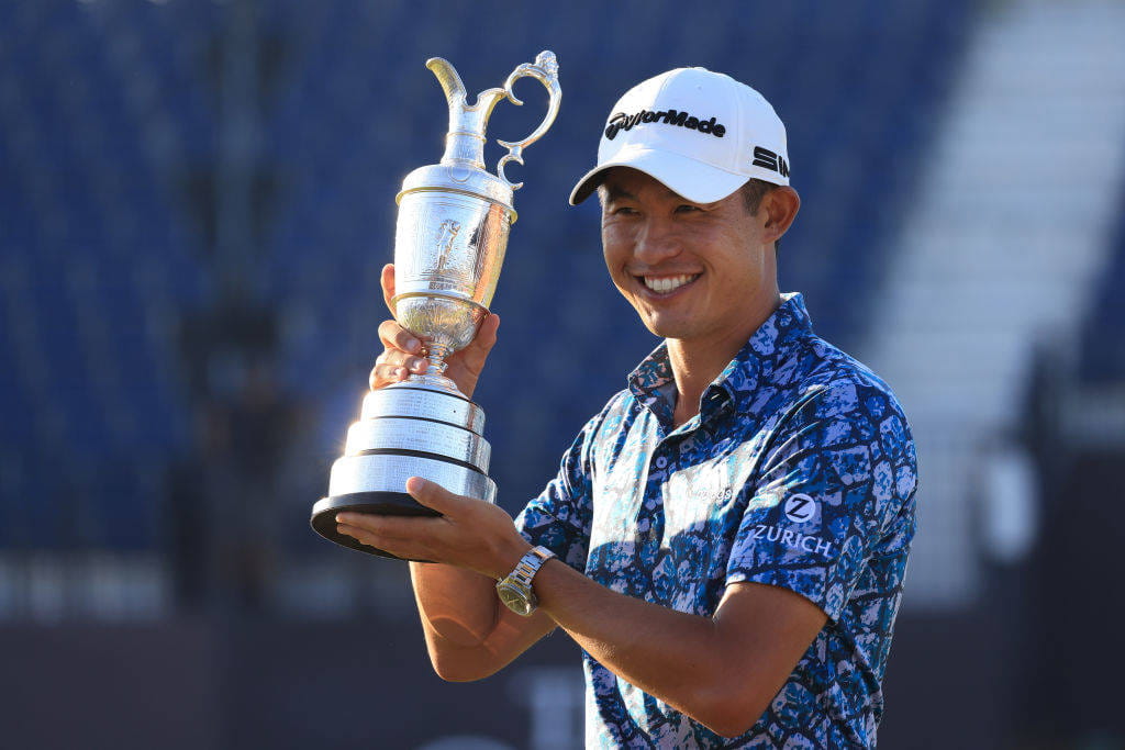 Collin Morikawa poses with the Claret Jug after winning The Open in 2021